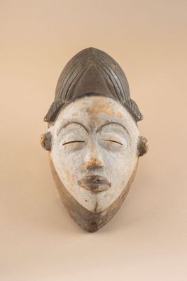 an image of a close up of a mask on a wall