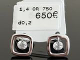 pair of black and white diamond stud earrings with price tag