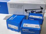 three boxes of delphi technologies sit next to each other on a table