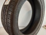 a close up of a tire on a white surface in a room