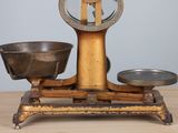 a scale that has a bowl on it on a table