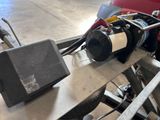 a motor that is sitting on a table in a garage