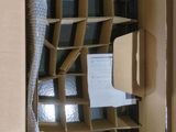 a cardboard box with a computer inside of it