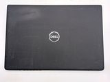 dell laptop with a black back and white logo on the screen
