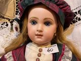 a close up of a doll with a tag on it