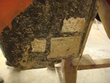 a close up of a piece of wood with a piece of paper on it