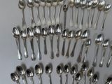 a lot of spoons and spoon spoons on the table