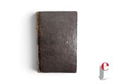 an old book that is sitting on a table