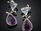 a pair of amethorate and aquamarinee earrings