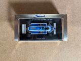 the model of a blue race car is in a clear box