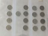 a lot of coins in a plastic bag on a table