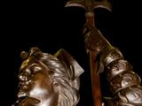 a statue of a man holding a sword in his hand