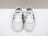 pair of white sneakers with blue and red stripes on them