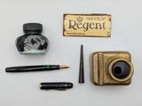 a bottle of ink, a fountain pen, and a box of ink sitting on a table