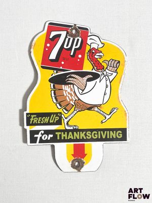 une affiche représentant une dinde sur laquelle on peut lire « 7 Up »