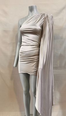 the mannequin is wearing a dress with a cape over it