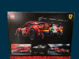 a box of legos with a picture of a red race car