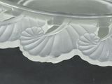 a clear glass bowl with a flower design on it