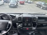 many cars parked in a parking lot in a lot