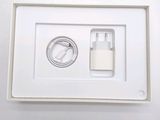 a picture of a white box with a charger and a cable