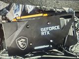 a close up of a black and yellow geforce rx graphics card