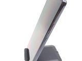 a phone that is sitting on top of a stand
