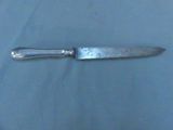a knife that is laying on a table