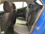 the back seats of a blue car are clean and ready to be used
