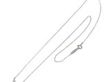a close up of a silver necklace with a fish on it