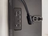 a picture of a laptop with a power cord plugged into it