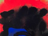 an abstract painting with black and red paint on a green background