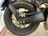 a close up of a motorcycle with a big tire