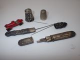 five different types of sewing tools on a white surface