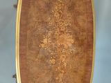 an antique wooden tray with a floral design on it
