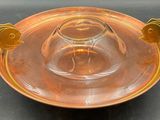 a glass bowl with a gold fish decoration on it