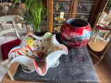 two vases that are sitting on a table