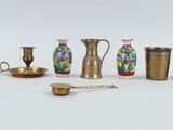 many different types of vases and bowls on the table