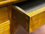 a wooden desk with a blackboard on top of it