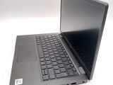 a laptop with a black keyboard on a white surface