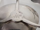 two spoons that are sitting on top of each other