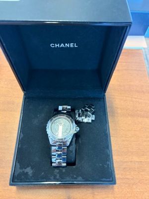 a watch sitting in a box on a table