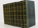 six green books lined up in a row on a white surface