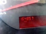 a digital clock on the dashboard of a car