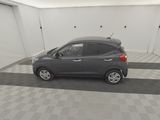 a picture of a grey car parked in a garage