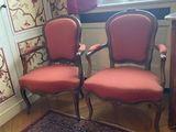 two chairs that are sitting in front of a window