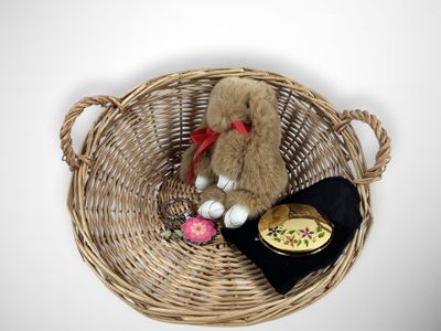 a teddy bear that is sitting in a basket