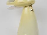 a yellow lamp that is sitting on a white table