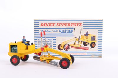 a yellow toy bulldozer with a man on top of it