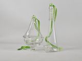 two clear glass vases with green ribbons and a green ribbon