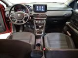 the interior of a car with a steering wheel, dashboard, and dashboard controls